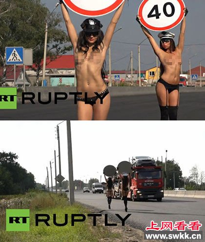 俄女模提醒司机控制车速裸胸举限速牌(图)